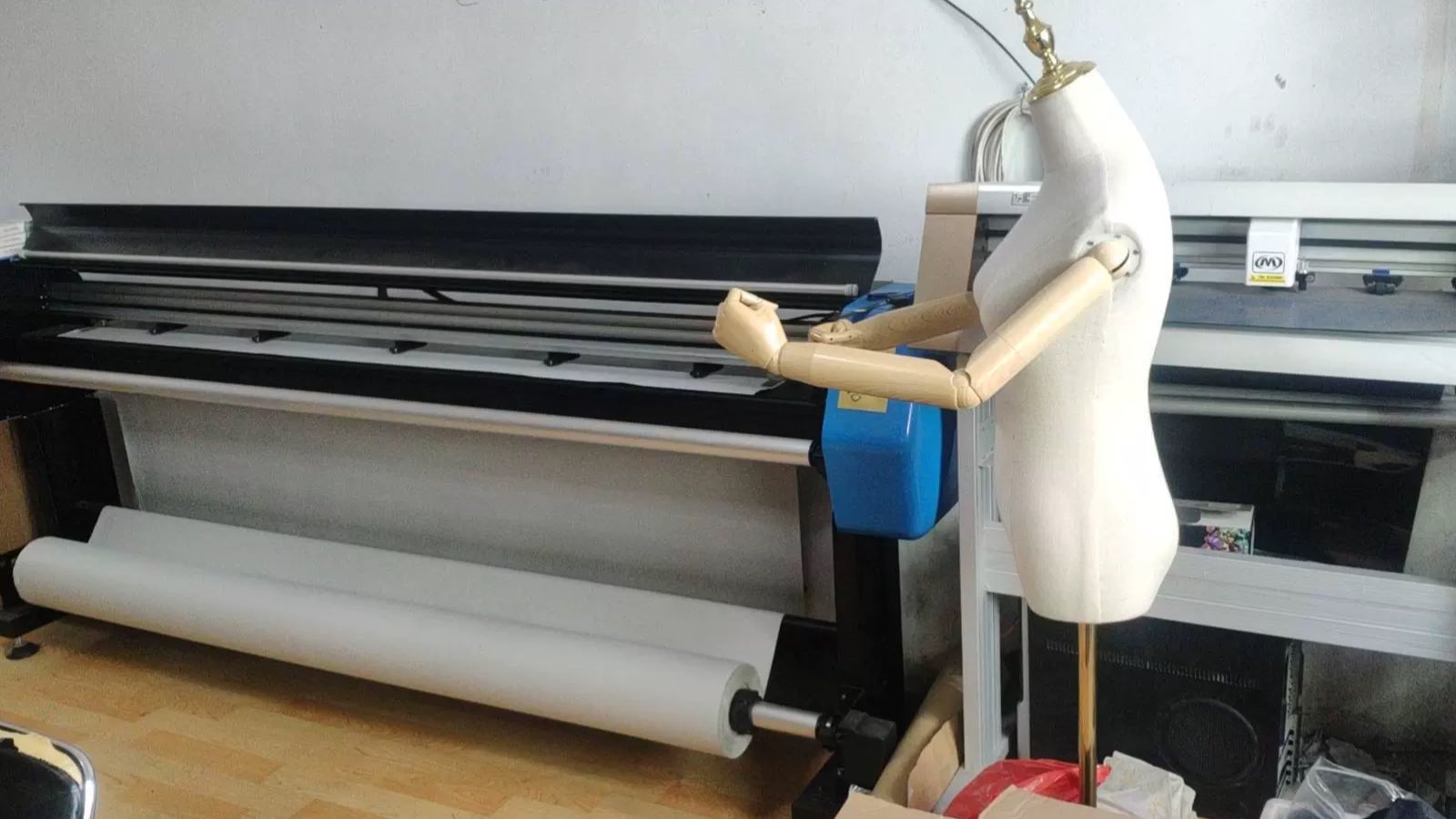 Large format pattern plotter, pattern cutting plotter and an articulated dress form in the sample room